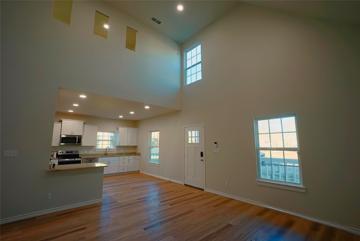233 Harrison Street Longview, TX 75601 - Photo 4 of 24 a view of kitchen with windows and refrigerator