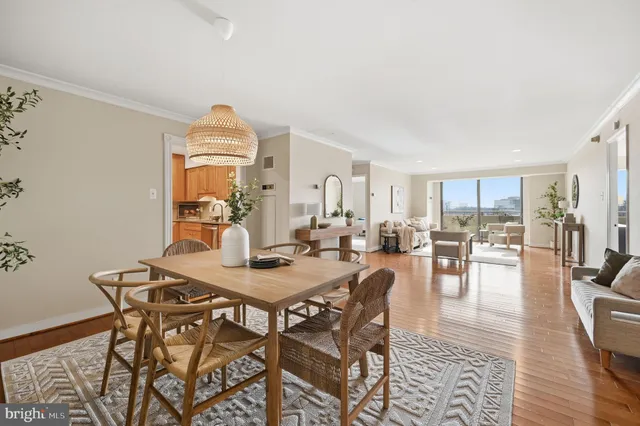 a view of a dining room with furniture and wooden floor