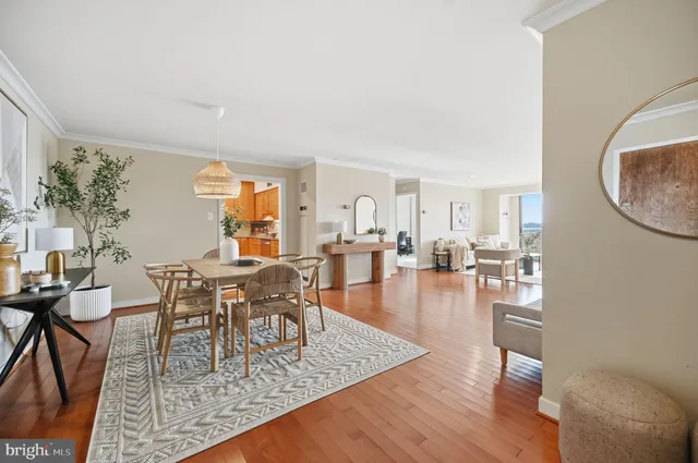 a view of a dining room with furniture and wooden floor