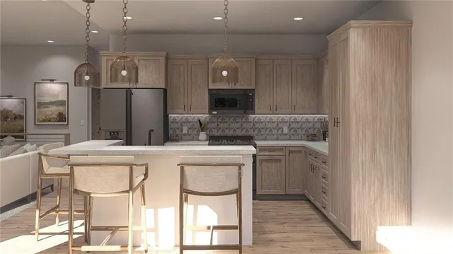 a kitchen with a cabinets and chairs