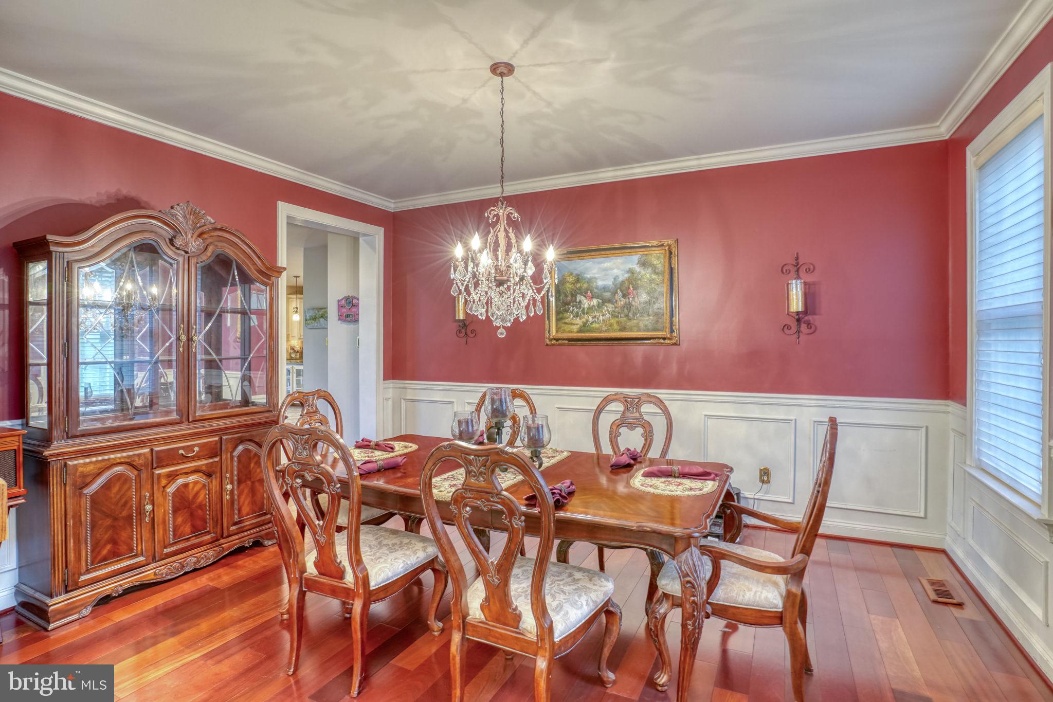 357 Willits Way Garnet Valley, PA 19060 - Photo 9 of 63 a view of a dining room with furniture a chandelier and wooden floor