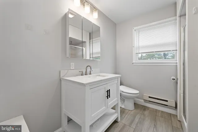 a view of bathroom with a sink and a toilet