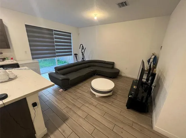 a bathroom with a sink a toilet a mirror and vanity