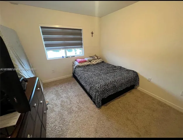 a living room with a couch and a window