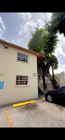 a view of balcony with wooden floor