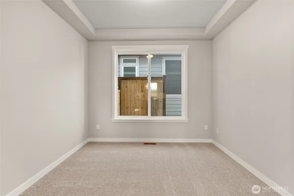 a work room with furniture and a window