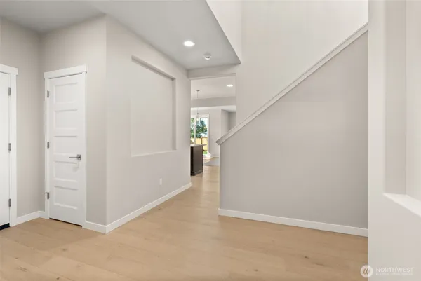 a view of an empty room with a fireplace and a window