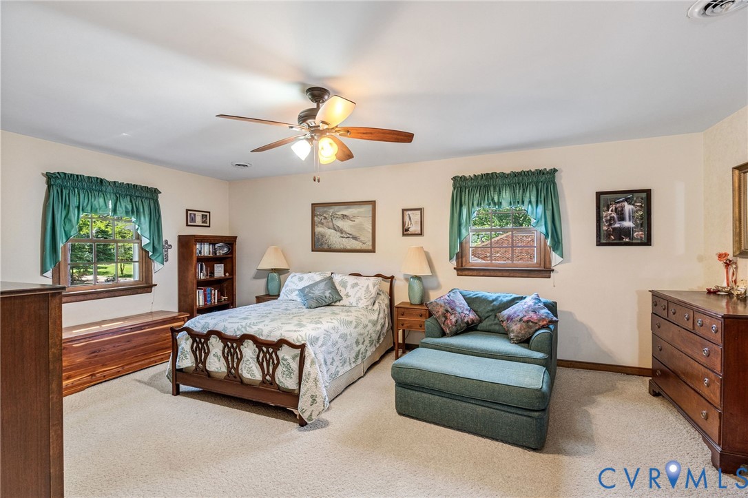 5700 Elfinwood Road Chester, VA 23831 - Photo 23 of 38 a bedroom with a bed couch and window