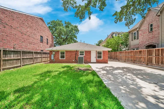 a view of a yard with a house and a garden