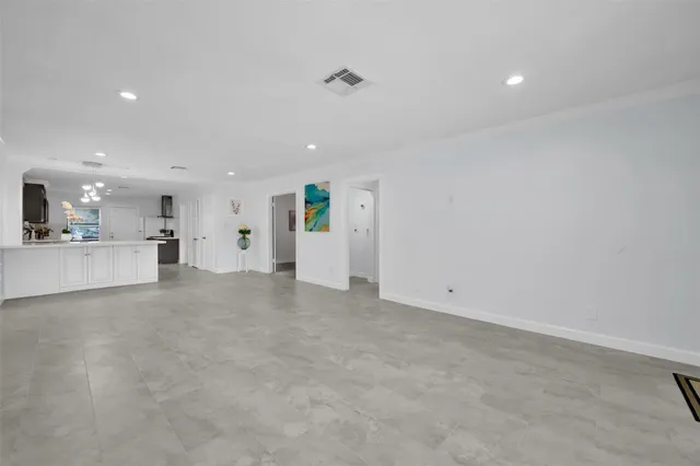 a view of a kitchen with a sink and cabinets