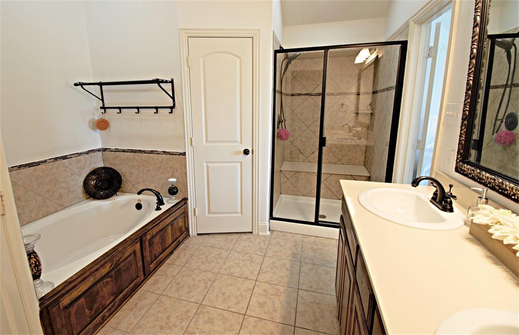 3702 Dogwood Road Melissa, TX 75454 - Photo 17 of 24 a room with a washing machine and a sink