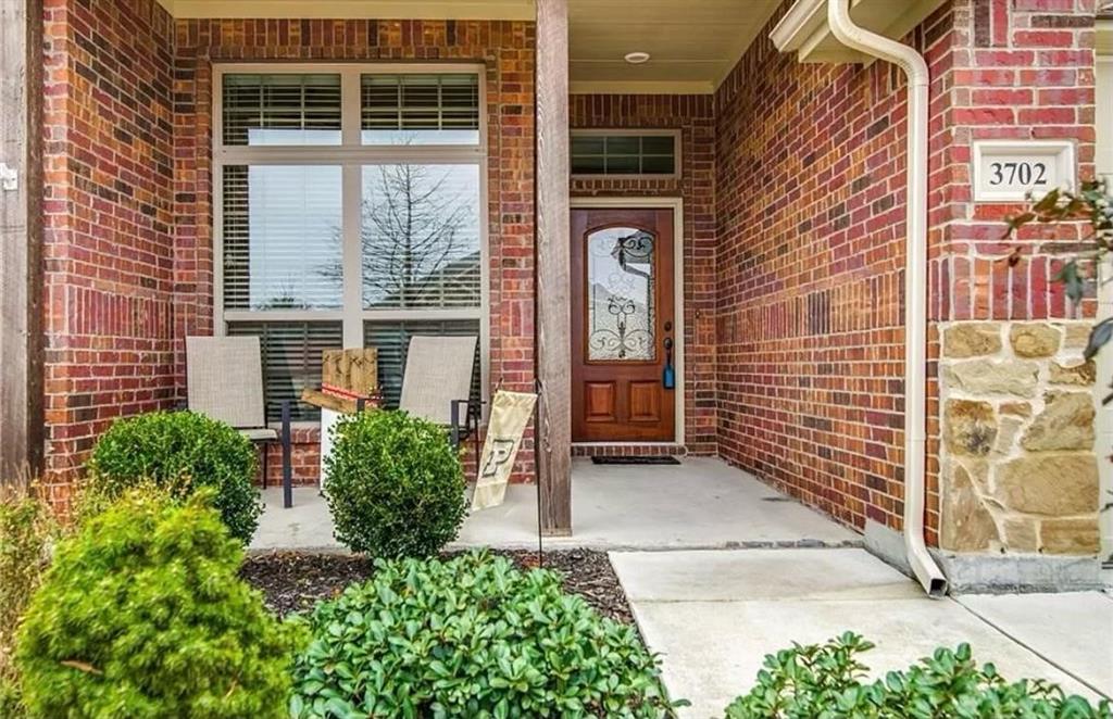3702 Dogwood Road Melissa, TX 75454 - Photo 2 of 24 a view of a brick house with a large window and a yard