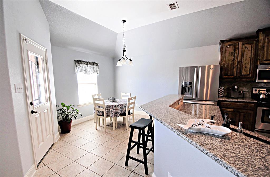3702 Dogwood Road Melissa, TX 75454 - Photo 6 of 24 a view of a dining room with furniture window and wooden floor
