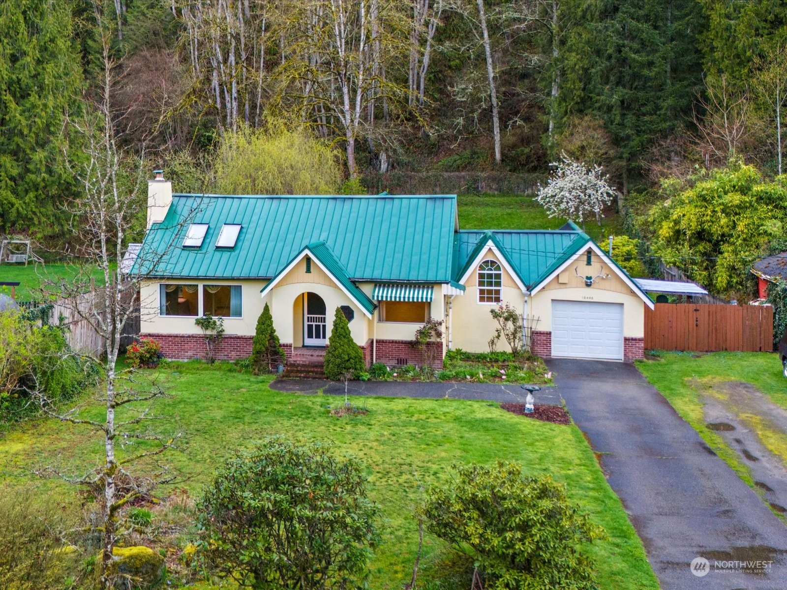 16446 Southeast Jones Road Renton, WA 98058 - Photo 1 of 40 a view of front of a house with a yard