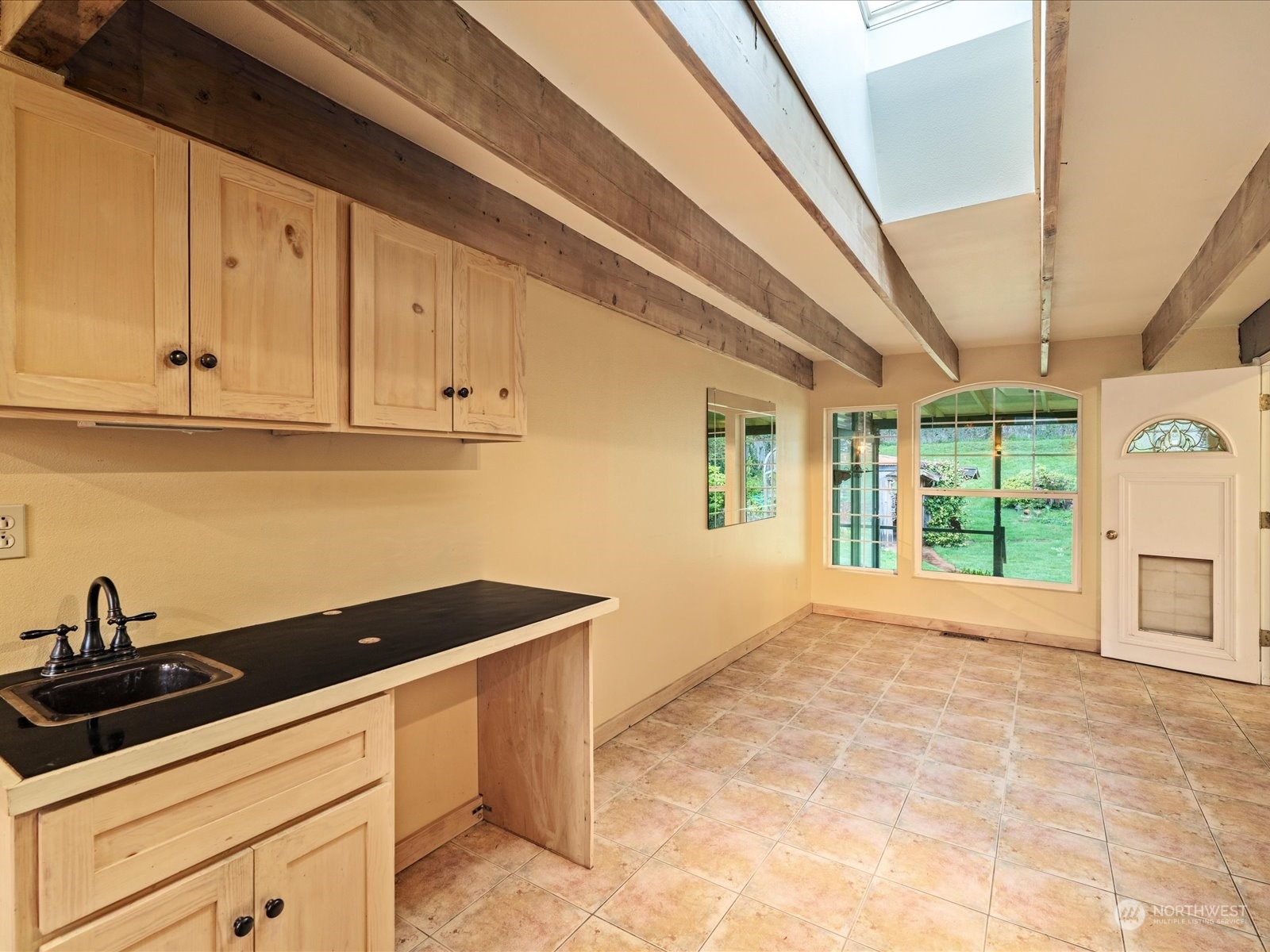 16446 Southeast Jones Road Renton, WA 98058 - Photo 17 of 40 a kitchen that has a sink and a stove