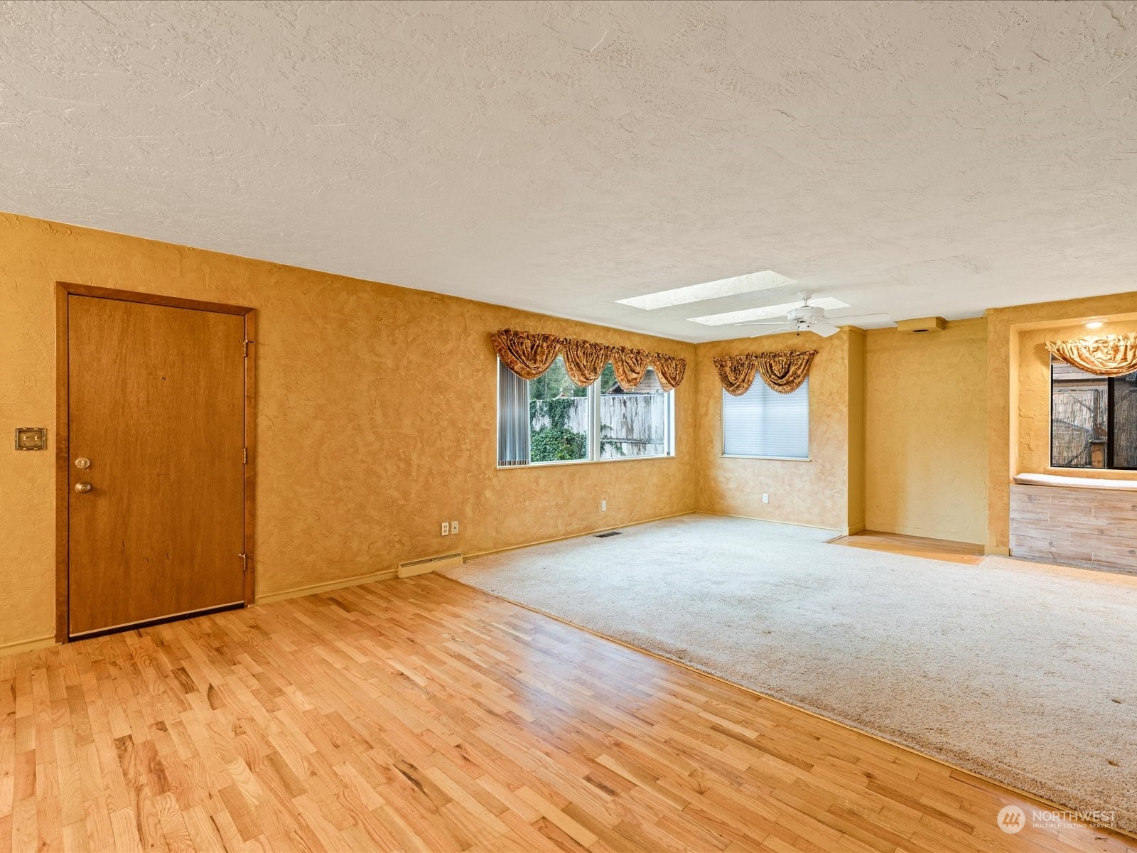 16446 Southeast Jones Road Renton, WA 98058 - Photo 3 of 40 a view of an empty room and window