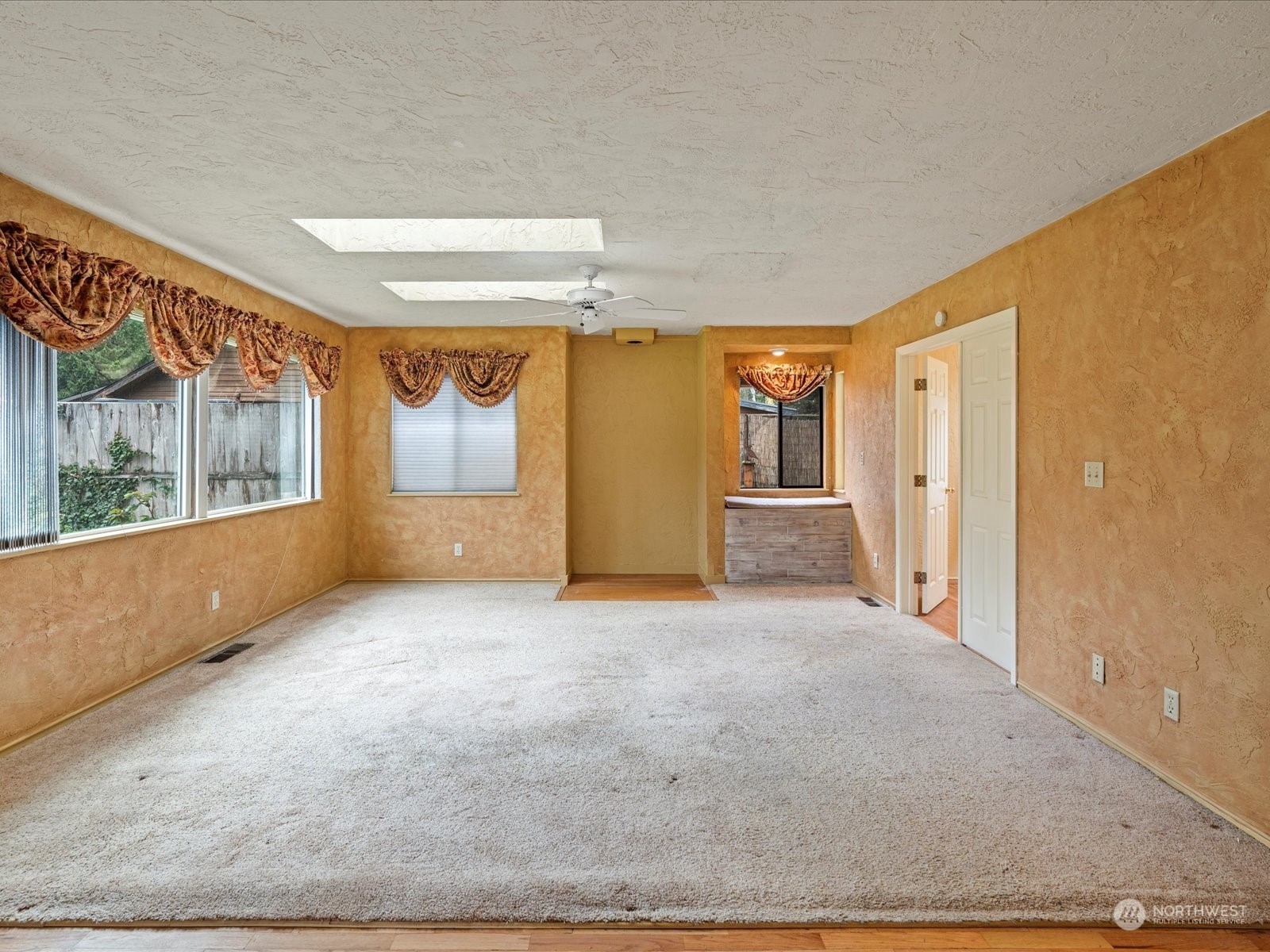 16446 Southeast Jones Road Renton, WA 98058 - Photo 6 of 40 a view of an empty room with a window