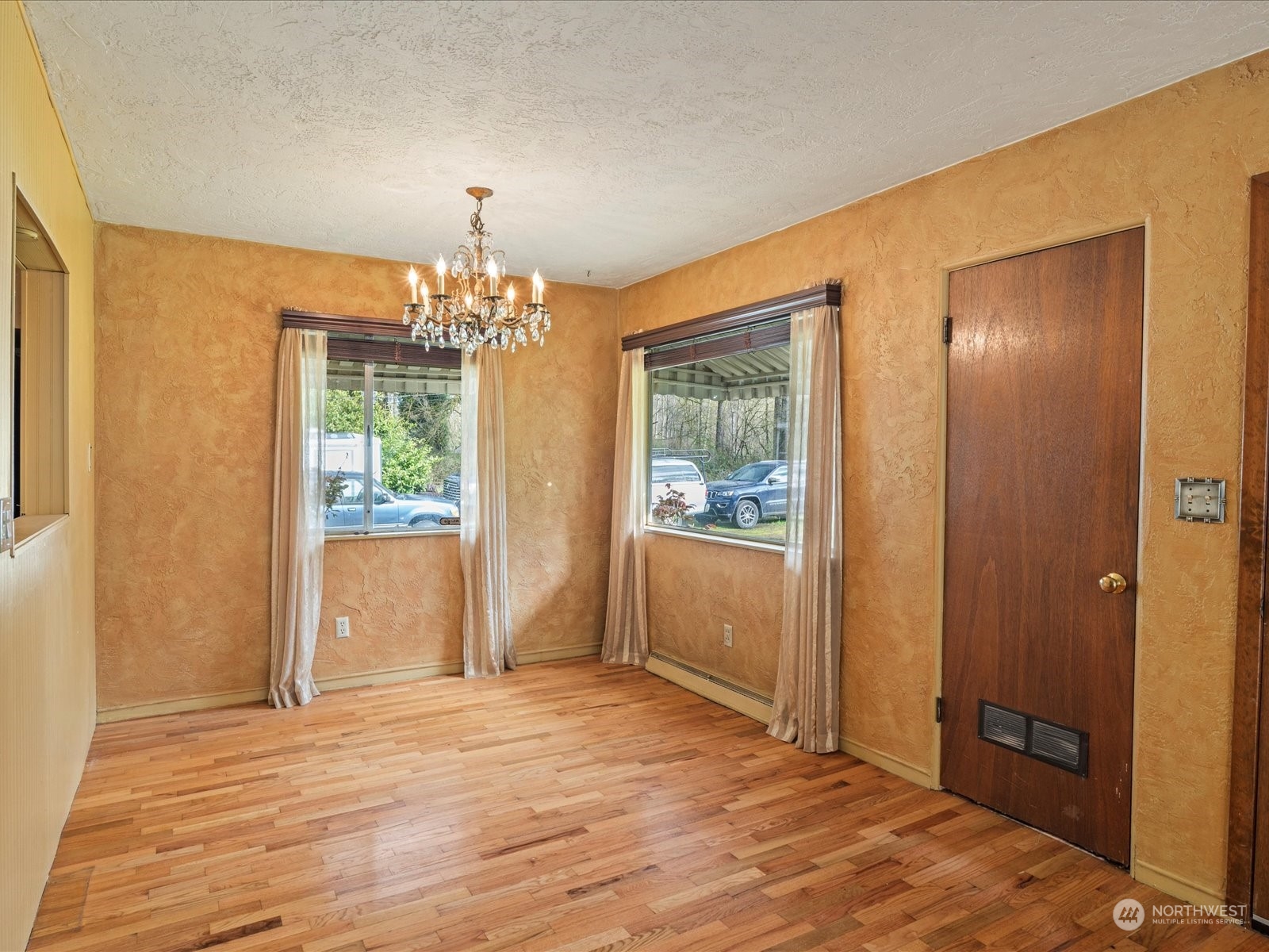 16446 Southeast Jones Road Renton, WA 98058 - Photo 8 of 40 a view of an empty room with a window