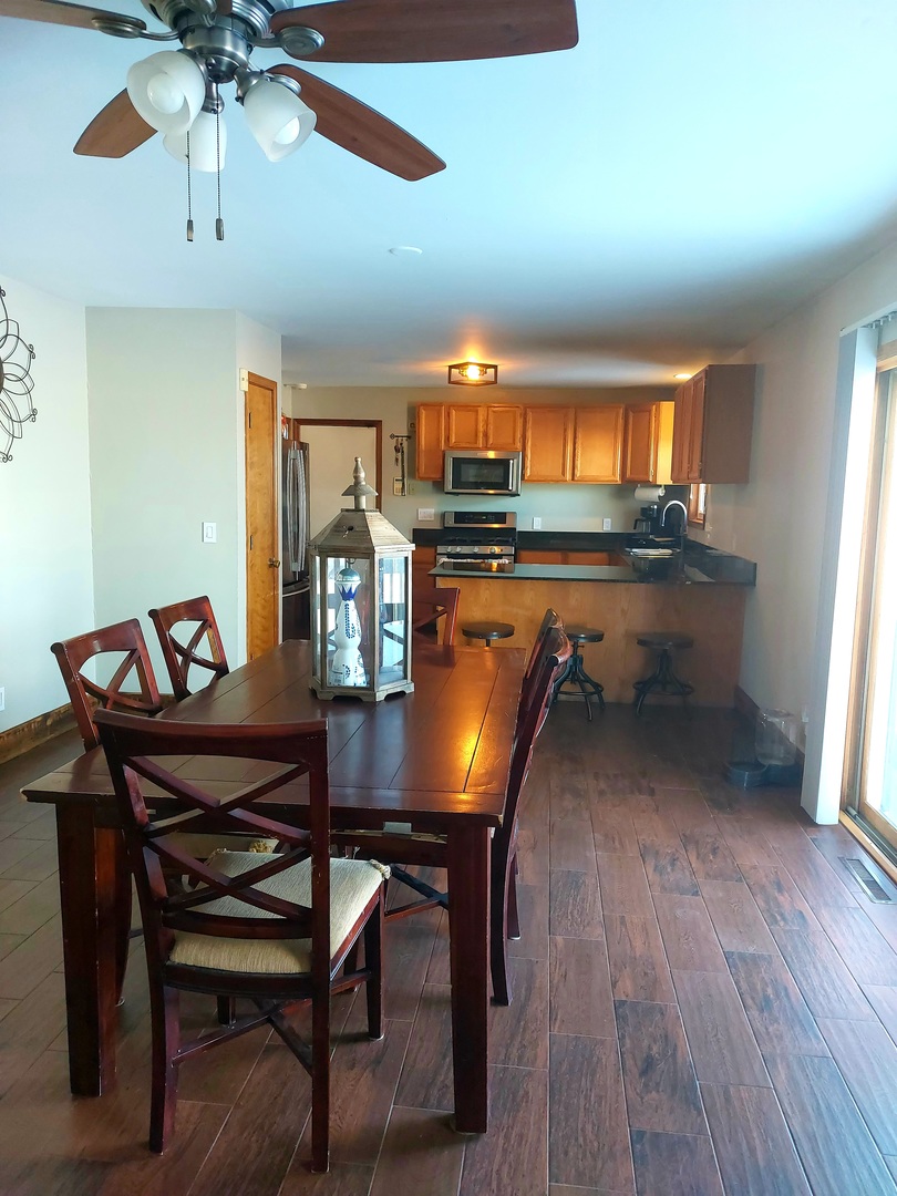 44-w046 Rohrsen Road Hampshire, IL 60140 - Photo 11 of 34 a view of a dining room with furniture window and wooden floor