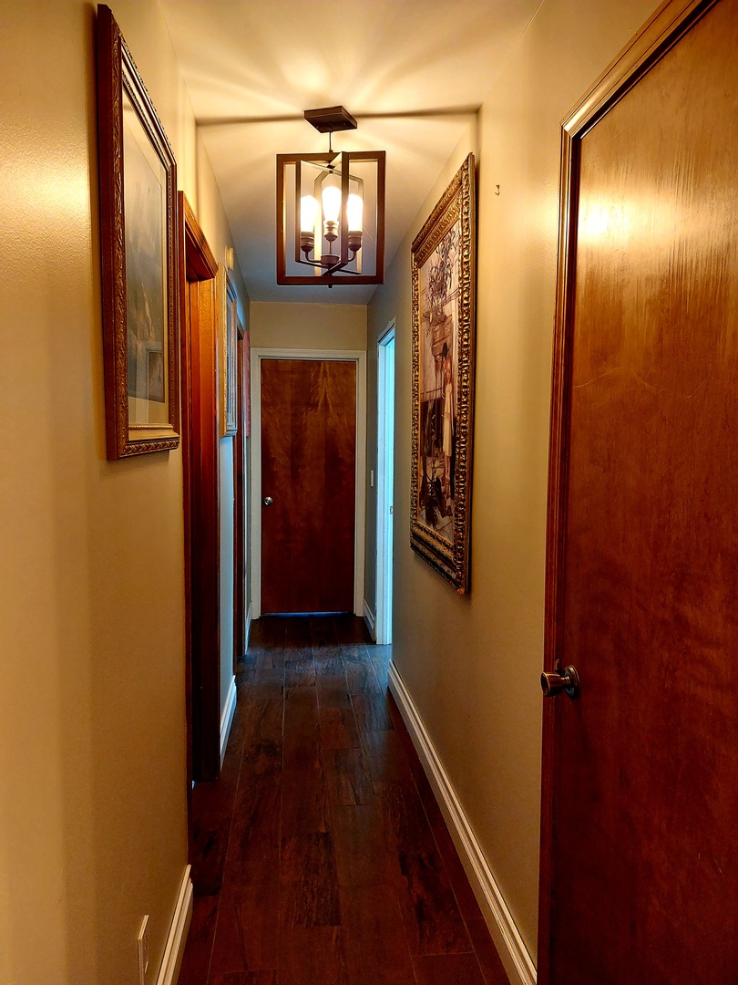 44-w046 Rohrsen Road Hampshire, IL 60140 - Photo 19 of 34 a view of a hallway with wooden floor and staircase