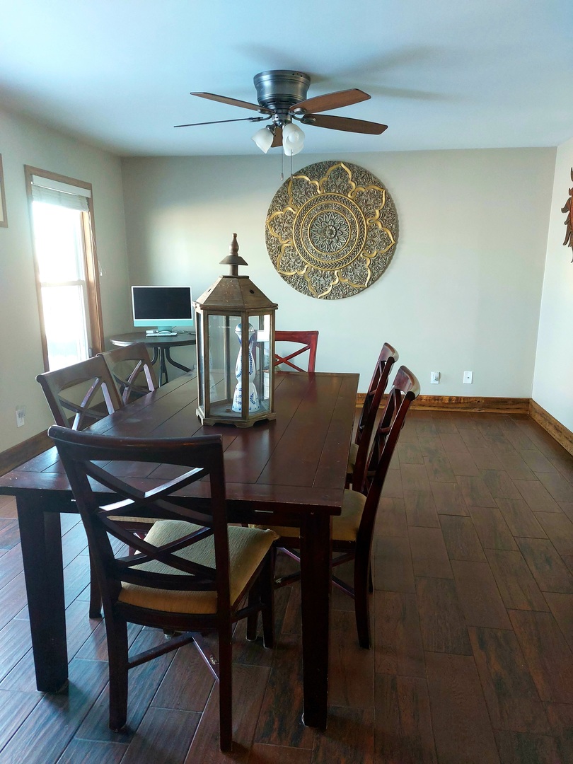 44-w046 Rohrsen Road Hampshire, IL 60140 - Photo 10 of 34 a view of a dining room with furniture and a chandelier