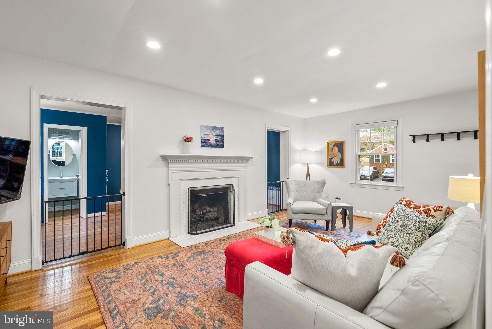 10115 Big Rock Road Silver Spring, MD 20901 - Photo 13 of 43 a living room with furniture and a fireplace