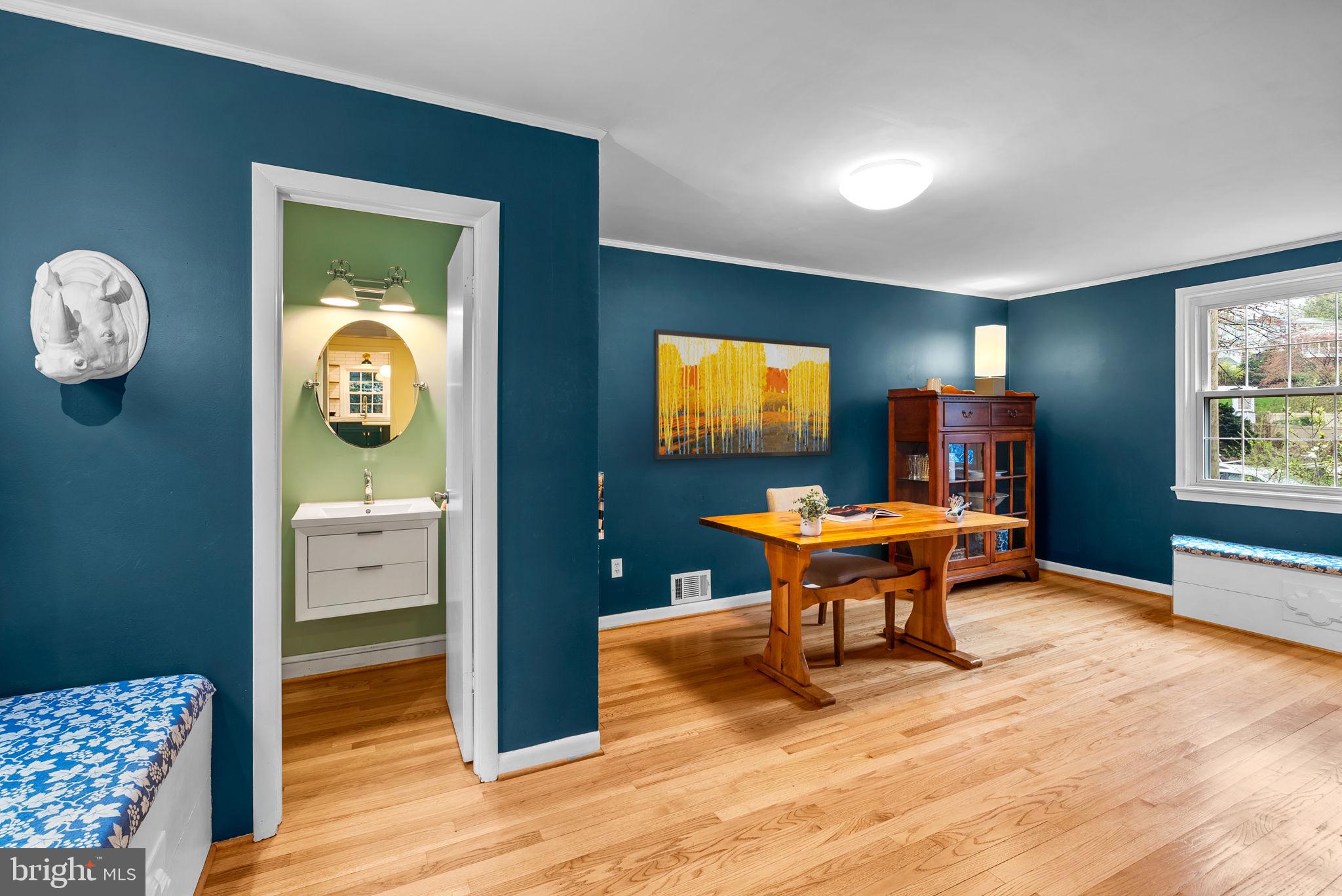 10115 Big Rock Road Silver Spring, MD 20901 - Photo 19 of 43 a view of a living room and bathroom with wooden floor
