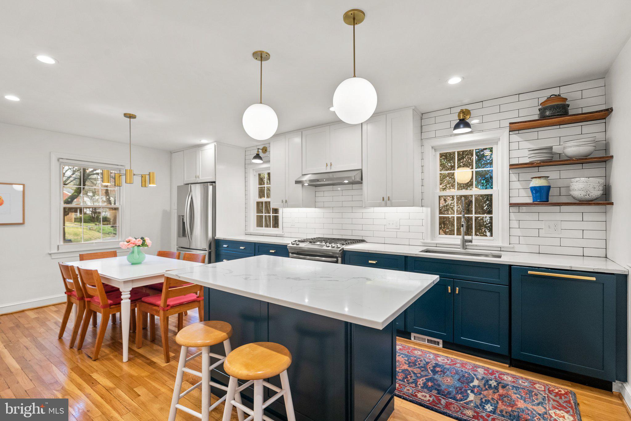 10115 Big Rock Road Silver Spring, MD 20901 - Photo 2 of 43 a large kitchen with a table and chairs