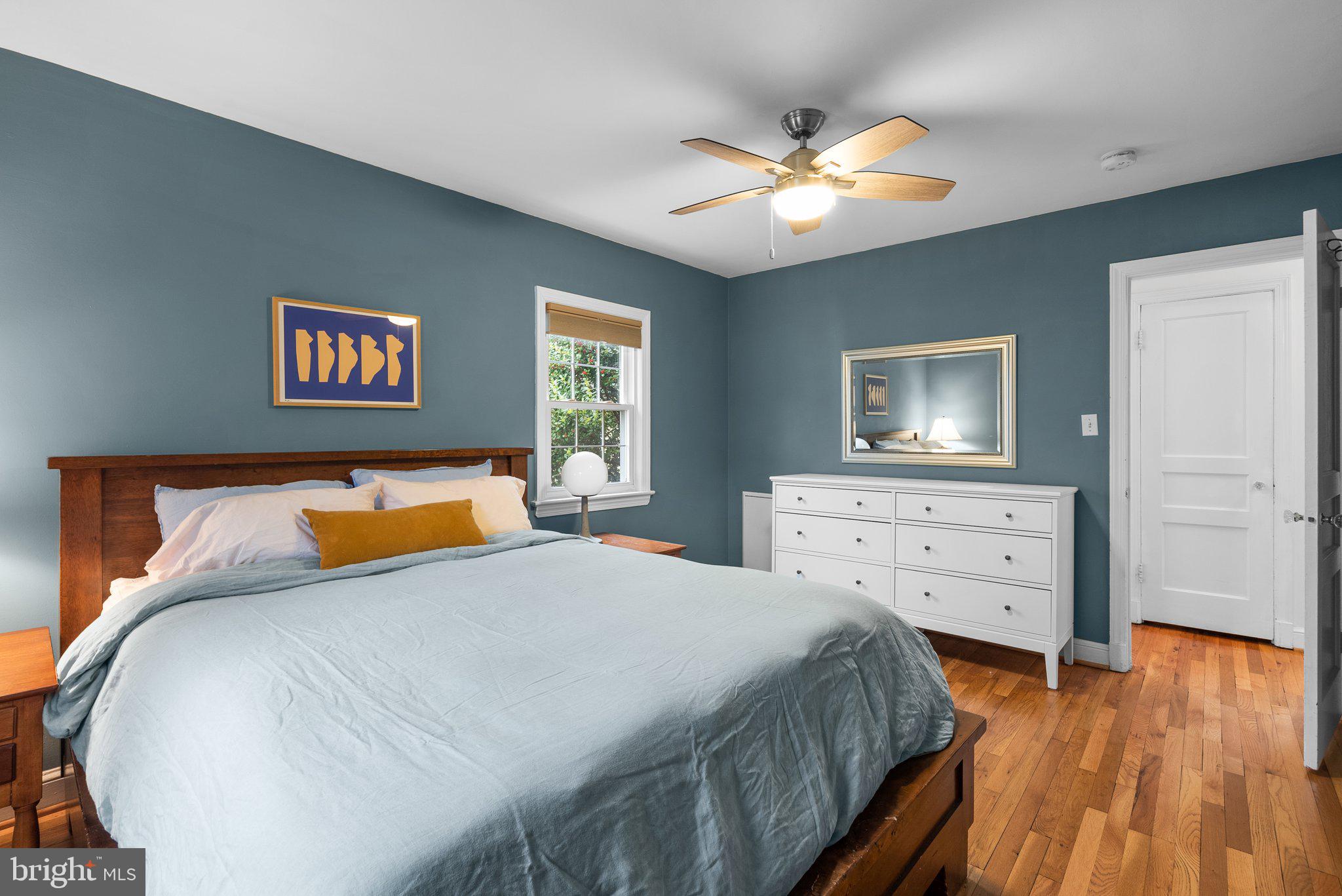 10115 Big Rock Road Silver Spring, MD 20901 - Photo 23 of 43 a bedroom with a bed and wooden floor