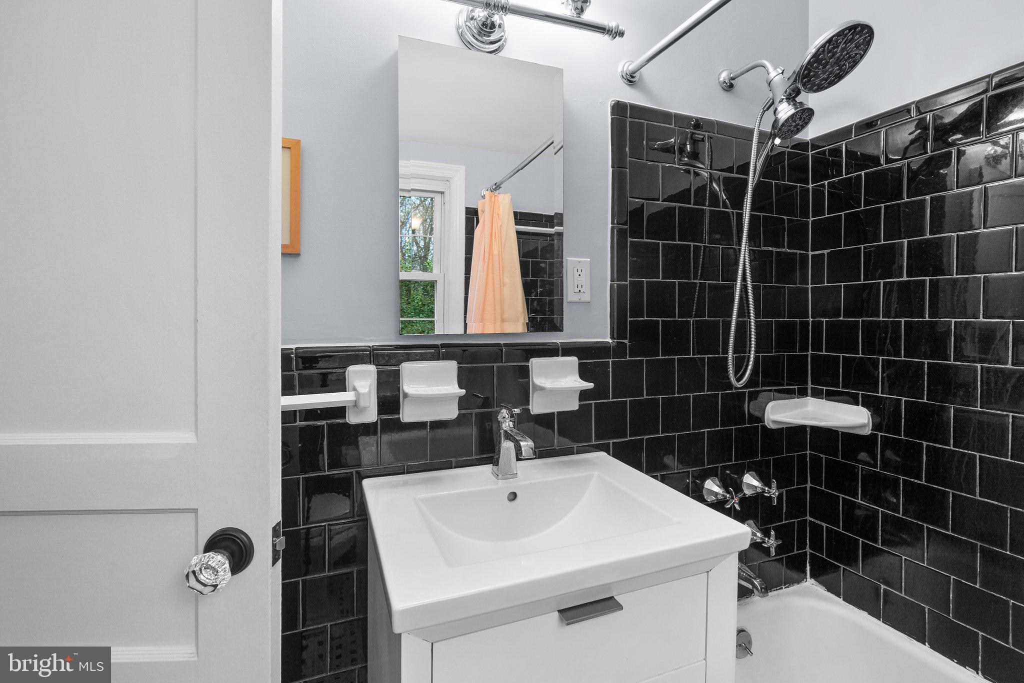 10115 Big Rock Road Silver Spring, MD 20901 - Photo 25 of 43 a bathroom with a sink a toilet and shower