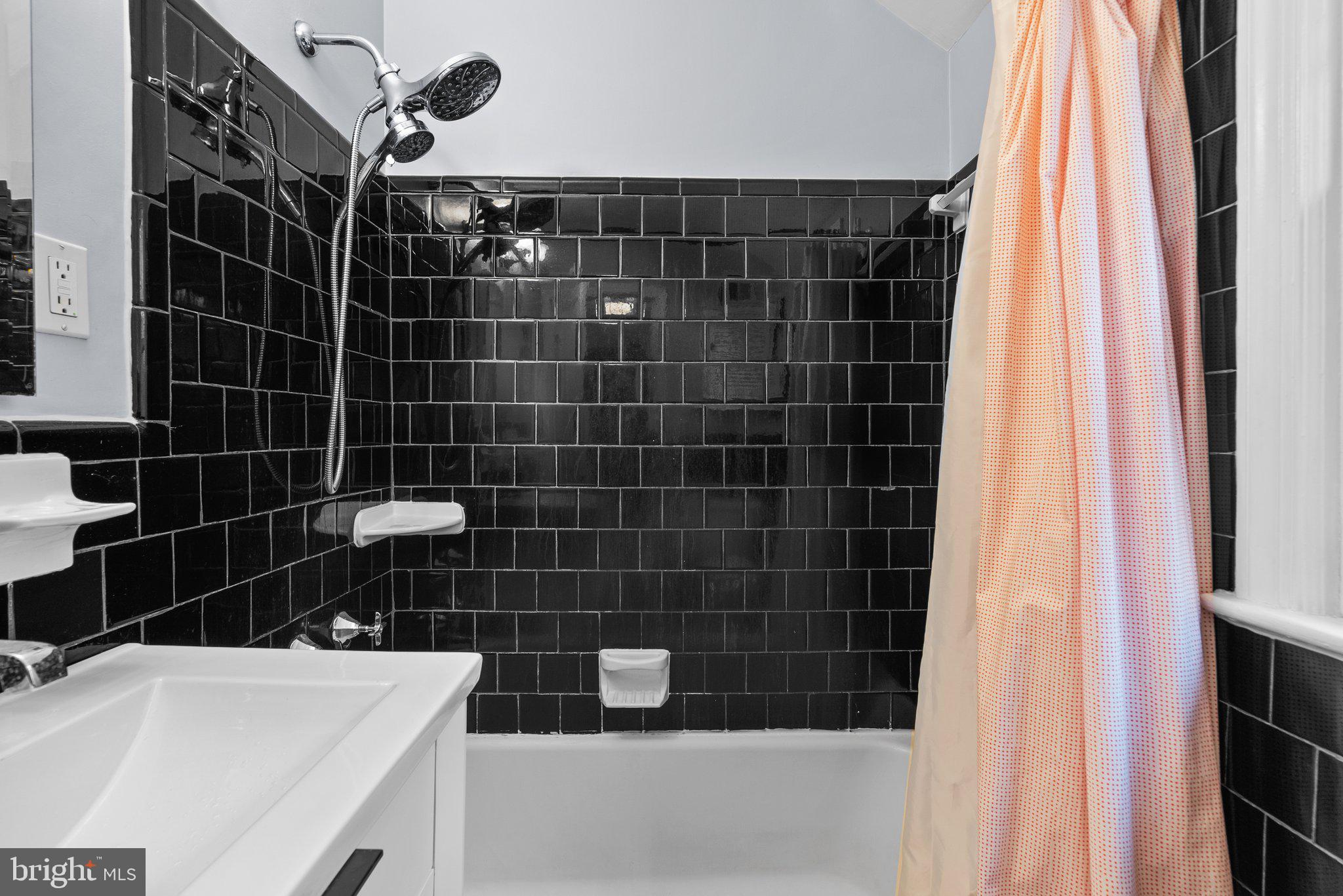 10115 Big Rock Road Silver Spring, MD 20901 - Photo 26 of 43 a bathroom with a bathtub and a shower