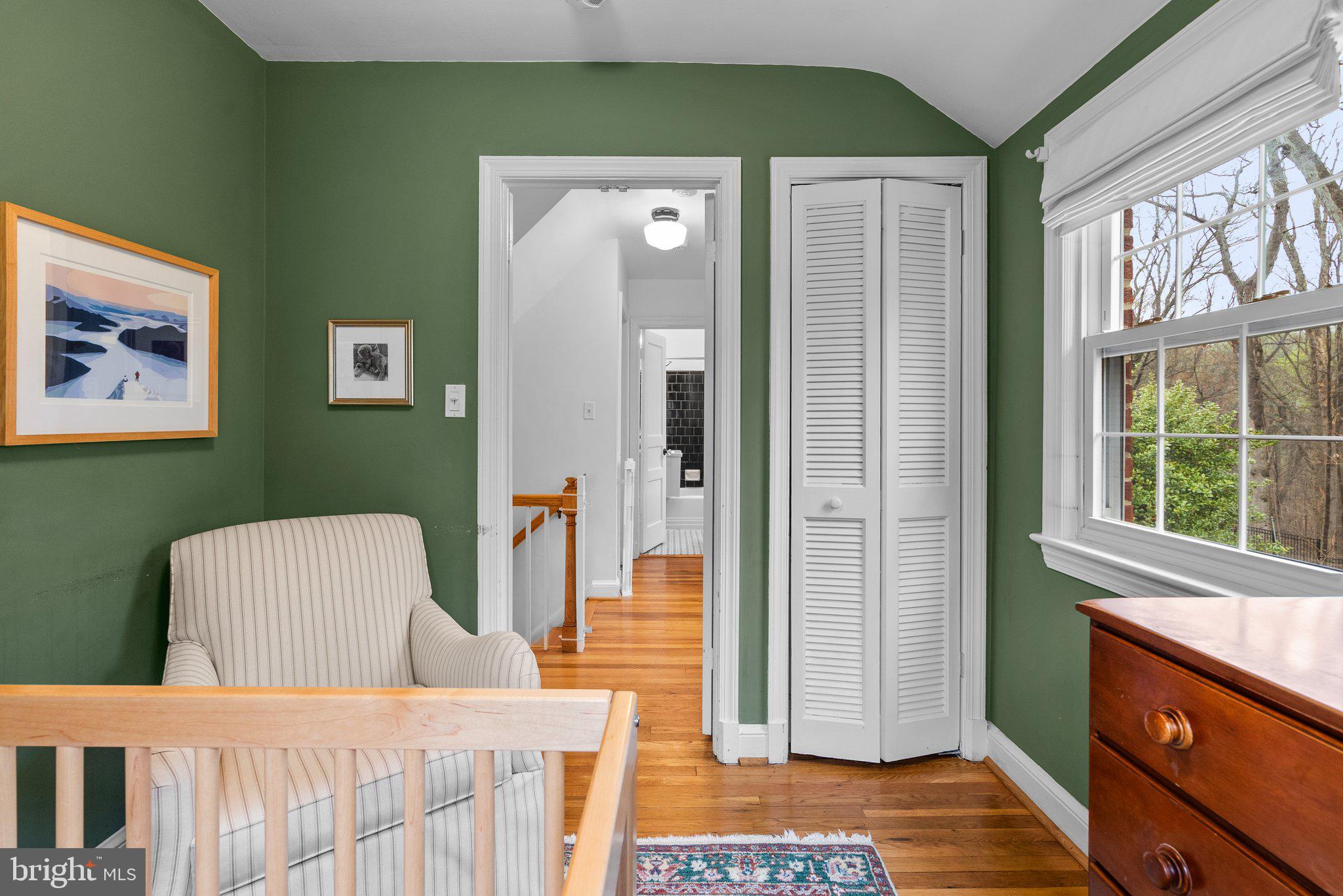 10115 Big Rock Road Silver Spring, MD 20901 - Photo 29 of 43 a bedroom with a bed and wooden floor