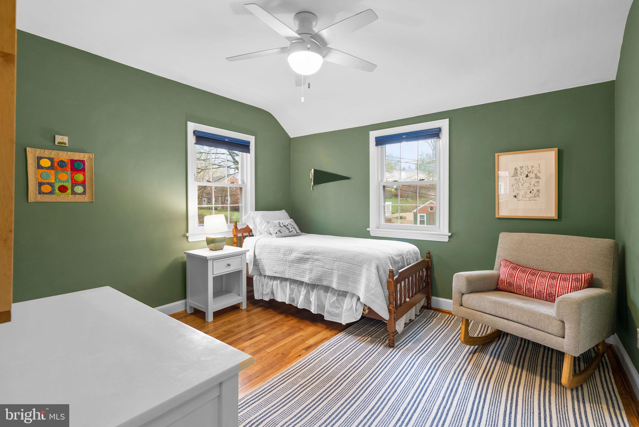 10115 Big Rock Road Silver Spring, MD 20901 - Photo 30 of 43 a bedroom with a bed and wooden floor