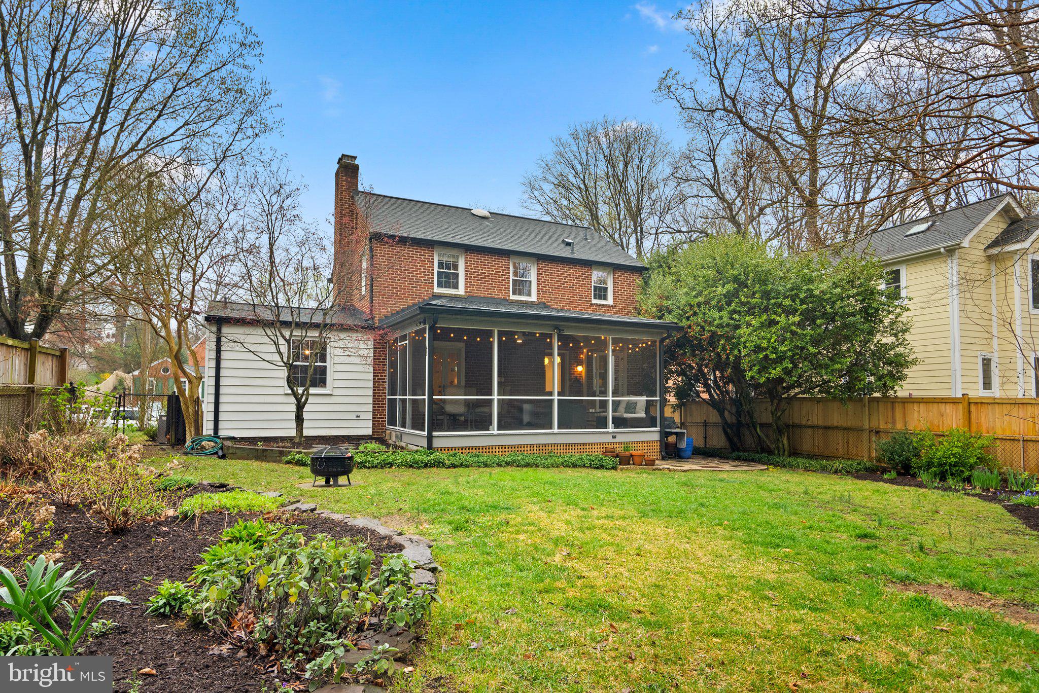 10115 Big Rock Road Silver Spring, MD 20901 - Photo 36 of 43 a view of a house with a yard and sitting area