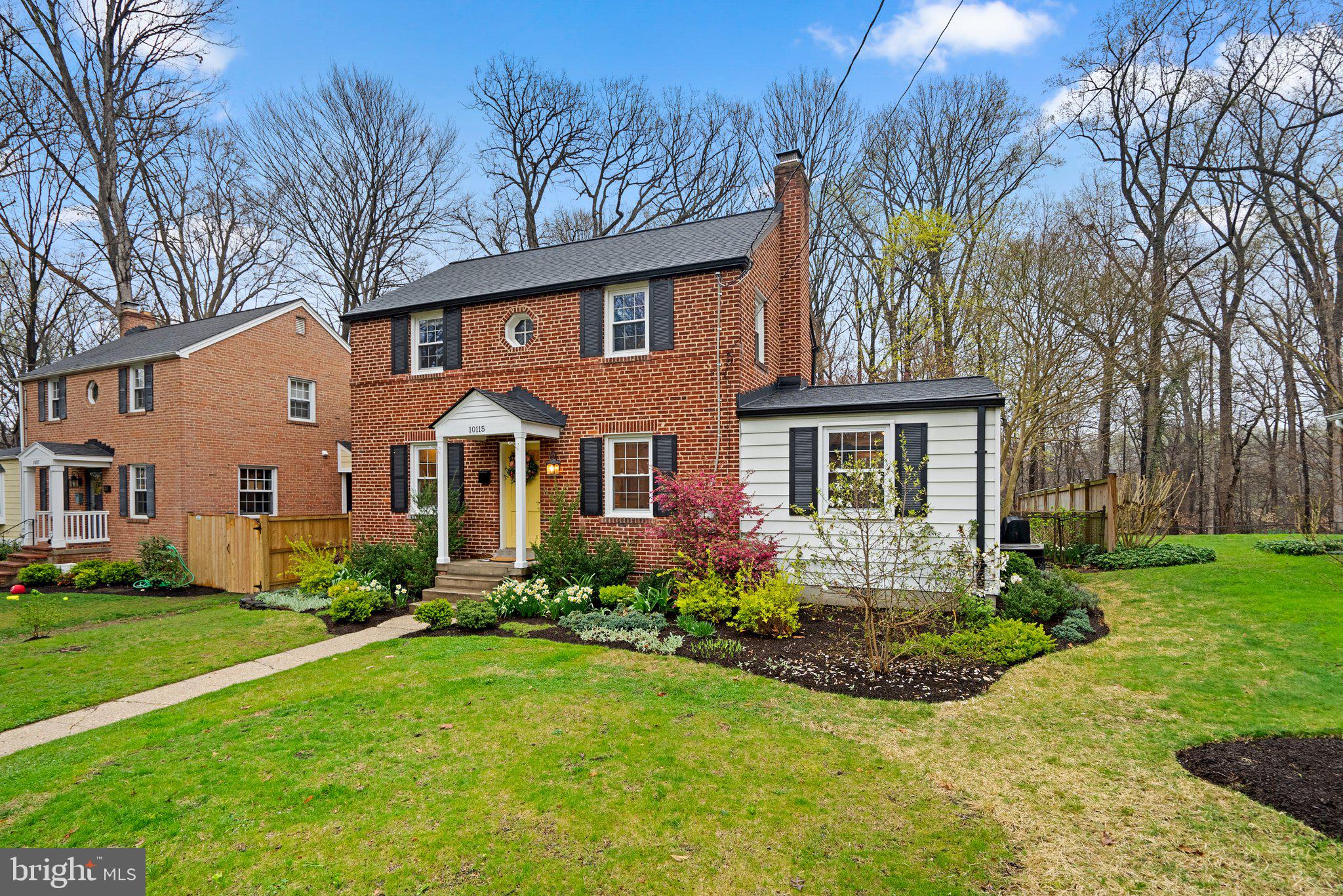 10115 Big Rock Road Silver Spring, MD 20901 - Photo 39 of 43 a front view of a house with a yard and porch