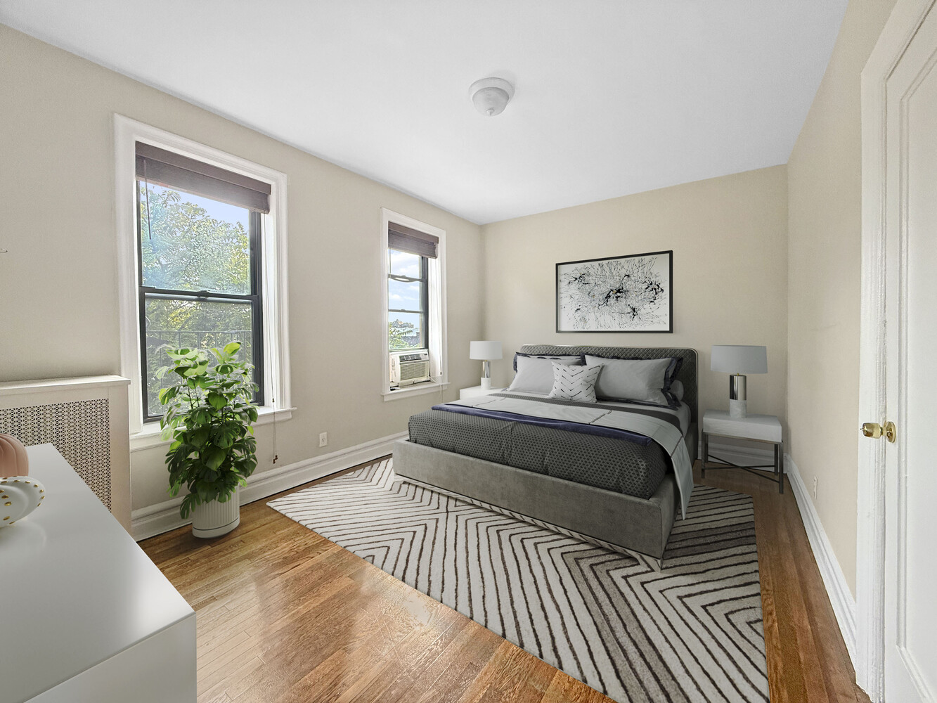 80 Winthrop Street, Unit L5 Brooklyn, NY 11225 - Photo 10 of 19 a spacious bedroom with a large bed a potted plant and a window