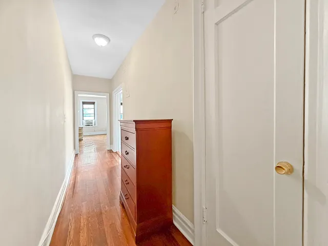 a view of a kitchen from the hallway