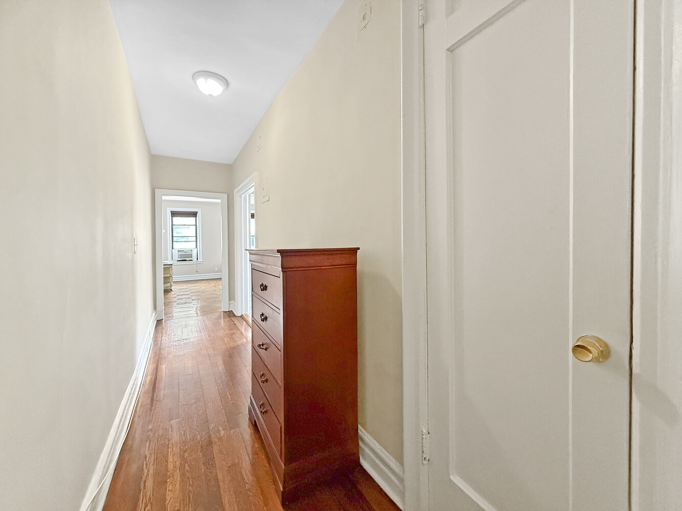 80 Winthrop Street, Unit L5 Brooklyn, NY 11225 - Photo 13 of 19 a view of a hallway with wooden floor and staircase