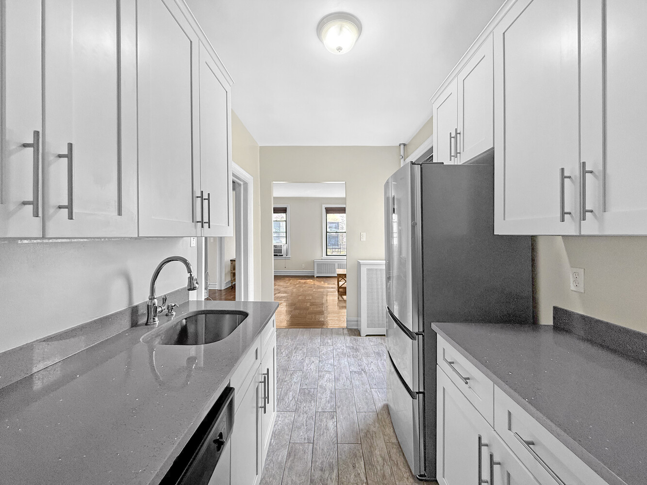 80 Winthrop Street, Unit L5 Brooklyn, NY 11225 - Photo 3 of 19 a kitchen with granite countertop a refrigerator and a sink