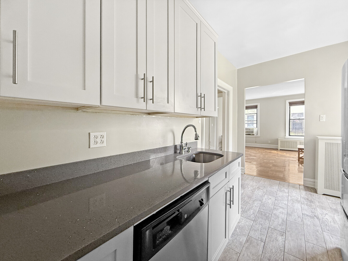 80 Winthrop Street, Unit L5 Brooklyn, NY 11225 - Photo 6 of 19 a kitchen with granite countertop a sink and cabinets