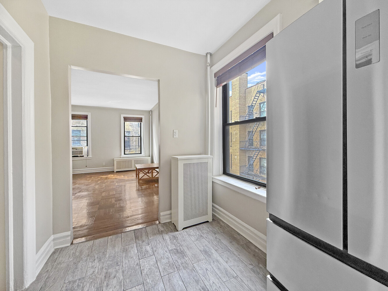 80 Winthrop Street, Unit L5 Brooklyn, NY 11225 - Photo 7 of 19 an empty room with wooden floor and windows
