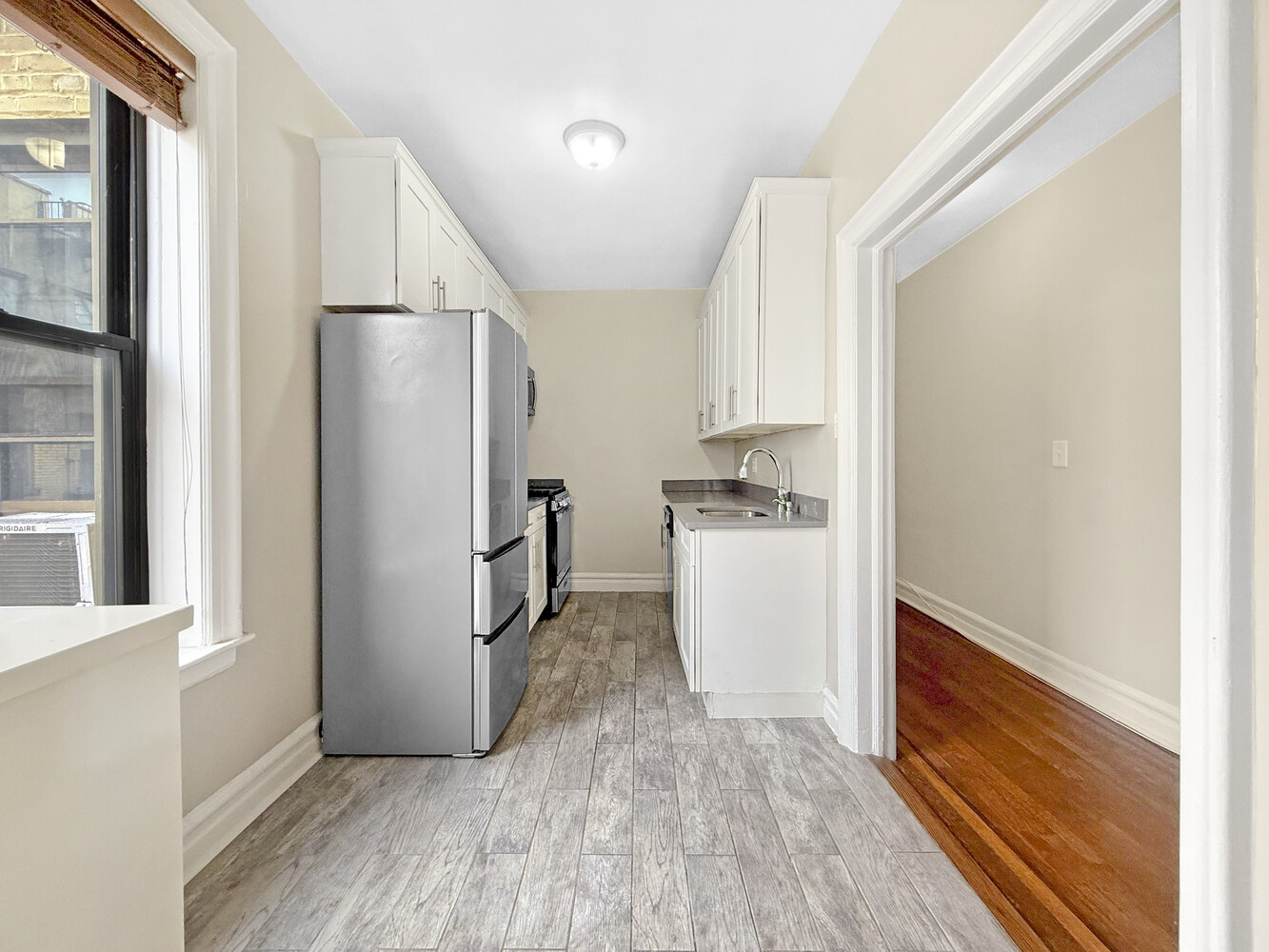 80 Winthrop Street, Unit L5 Brooklyn, NY 11225 - Photo 9 of 19 a kitchen with a refrigerator and a stove top oven