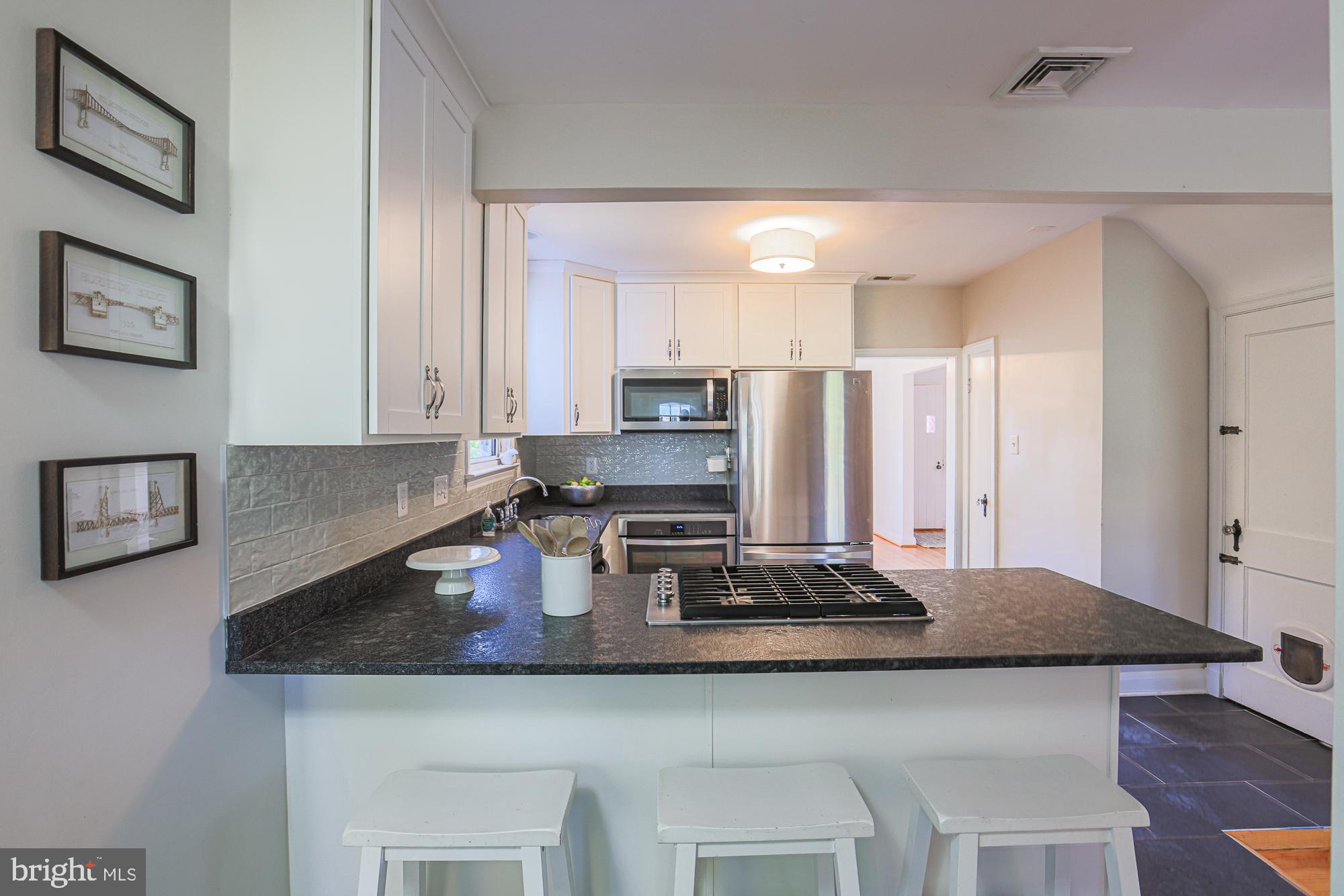 5508 South Bend Road Baltimore, MD 21209 - Photo 20 of 72 Kitchen overhang for entertaining