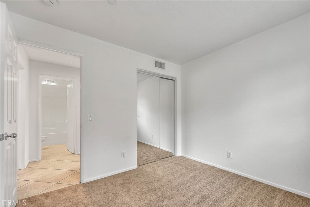 3874 Polk Street, Unit F Riverside, CA 92505 - Photo 27 of 50 Mirrored closet doors in guest bedroom