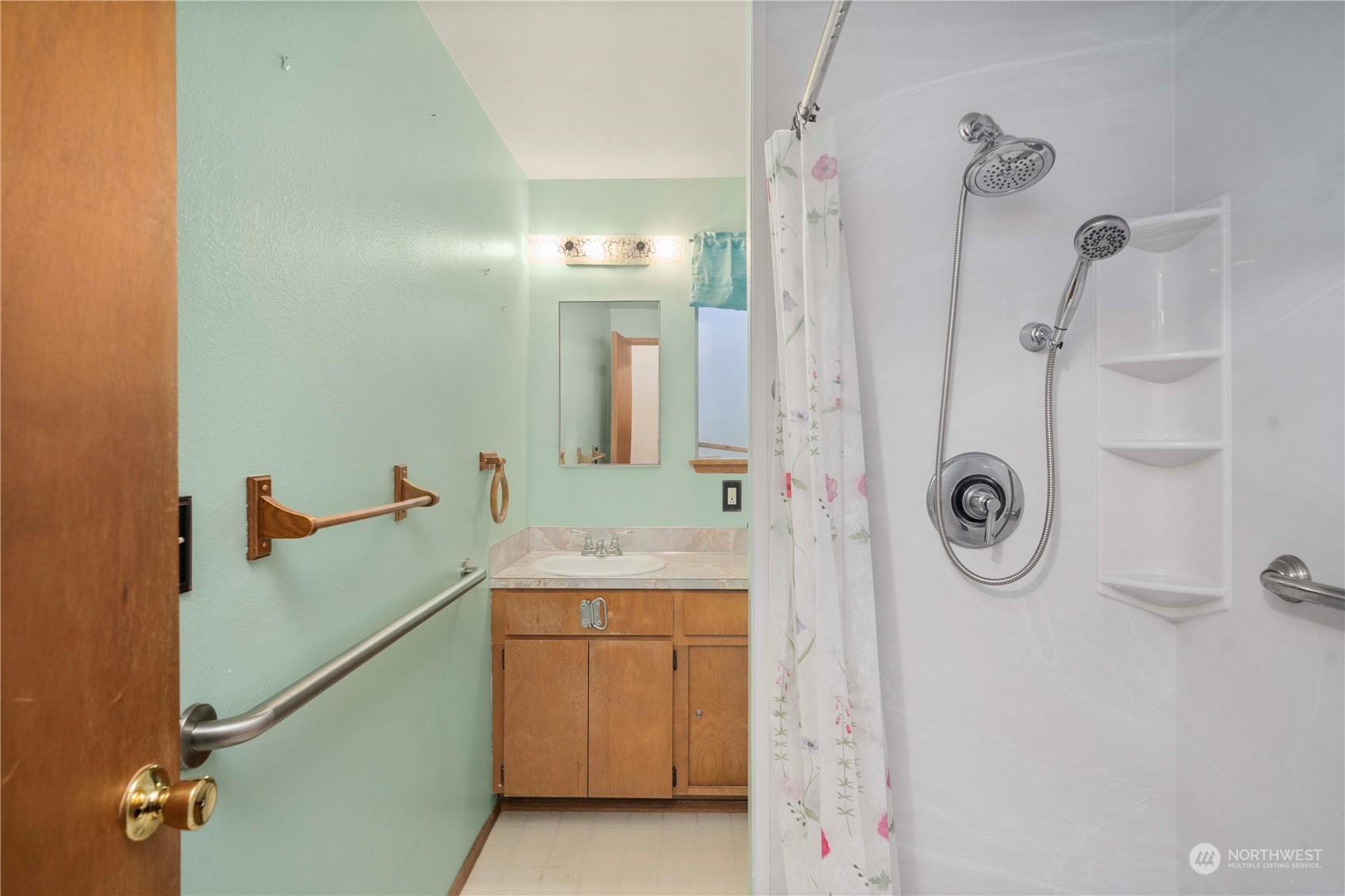 903 Southwest 104th Street Seattle, WA 98146 - Photo 15 of 26 a bathroom with a granite countertop shower a mirror and vanity