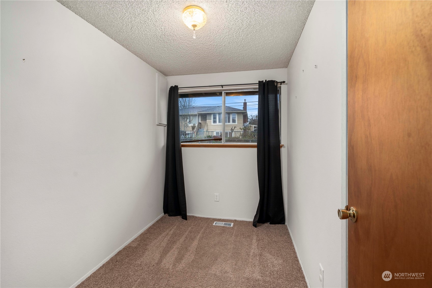 903 Southwest 104th Street Seattle, WA 98146 - Photo 17 of 26 an empty room with windows