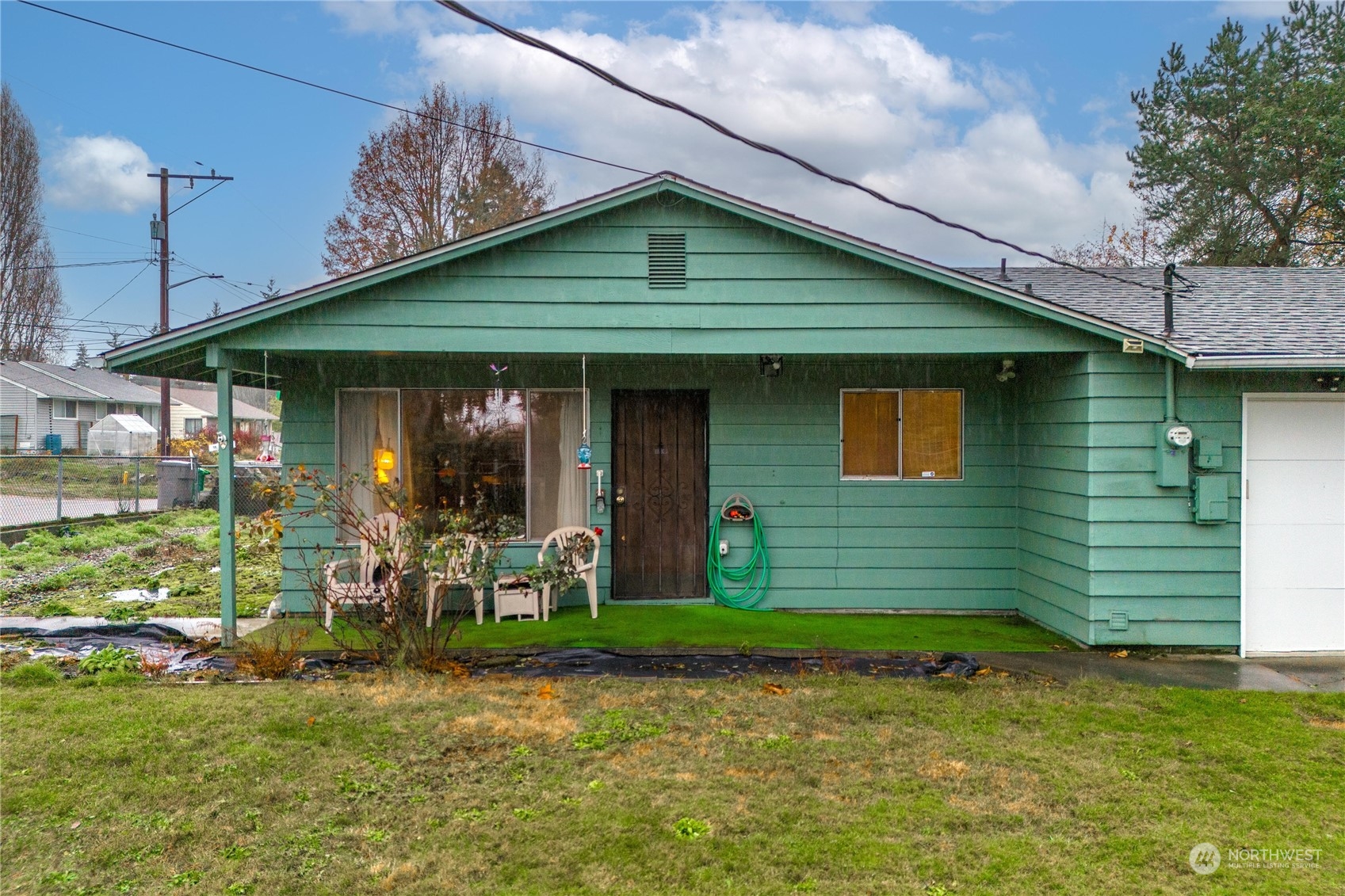 903 Southwest 104th Street Seattle, WA 98146 - Photo 2 of 26 a front view of a house with garden