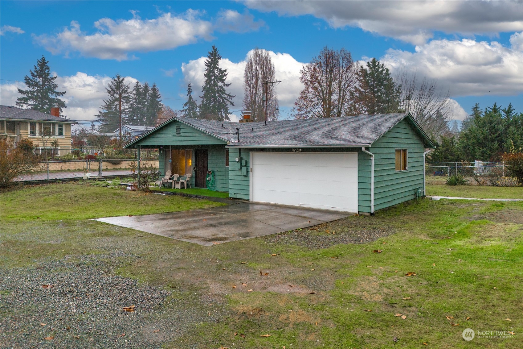 903 Southwest 104th Street Seattle, WA 98146 - Photo 4 of 26 a front view of a house with a yard