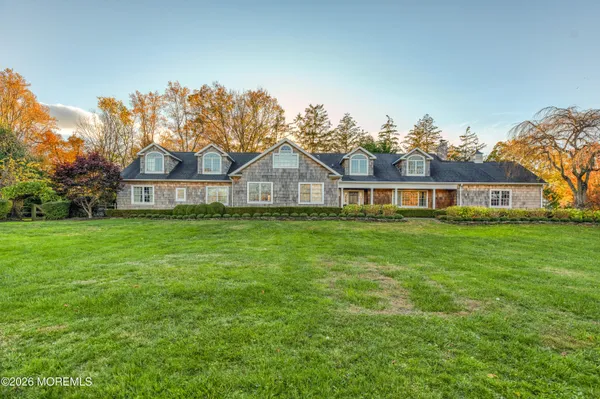 a front view of house with yard and seating area