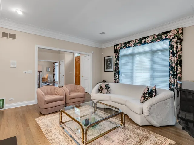 a view of a workspace with furniture and a fireplace